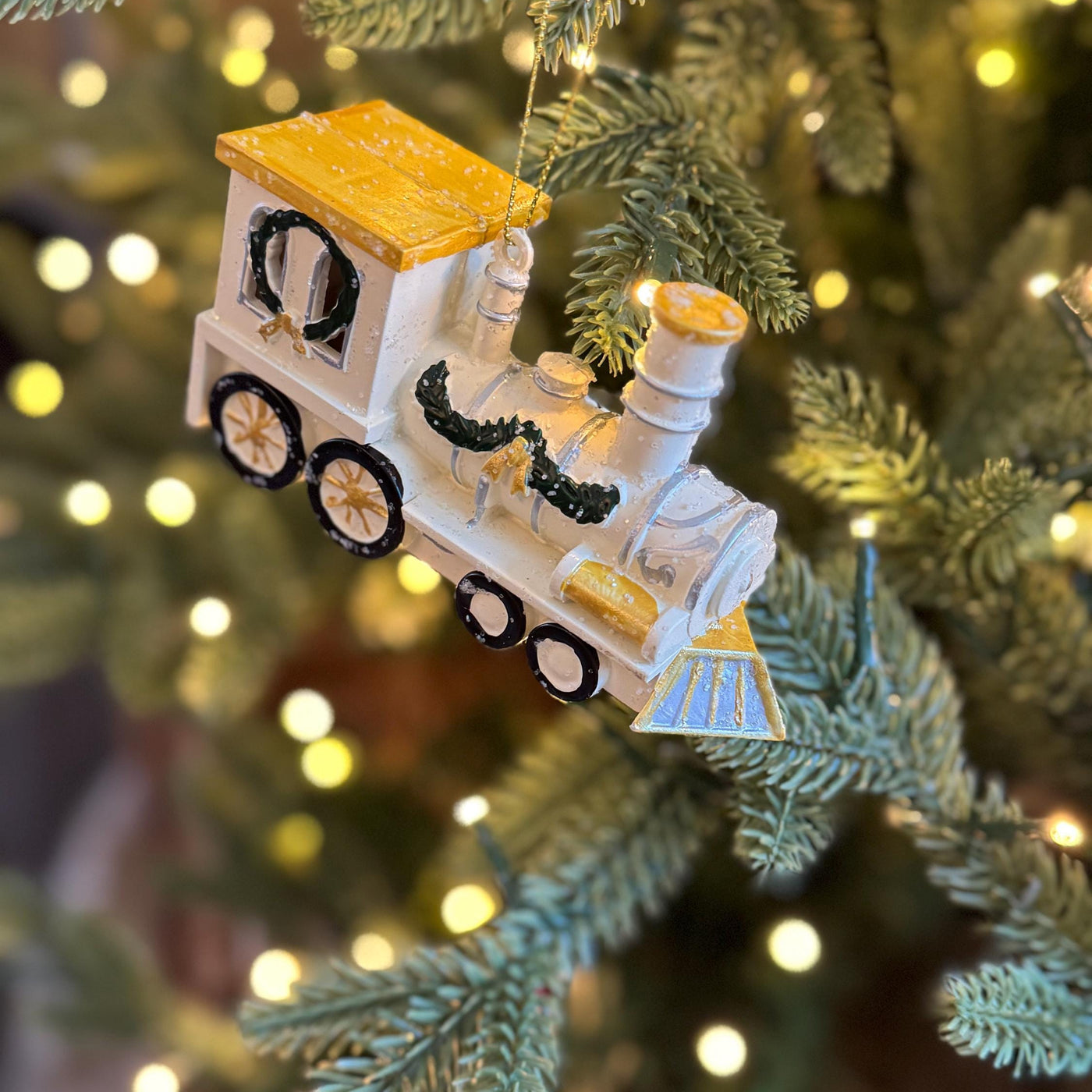 White & Gold Train Bauble – Festive locomotive ornament with green garland detail
