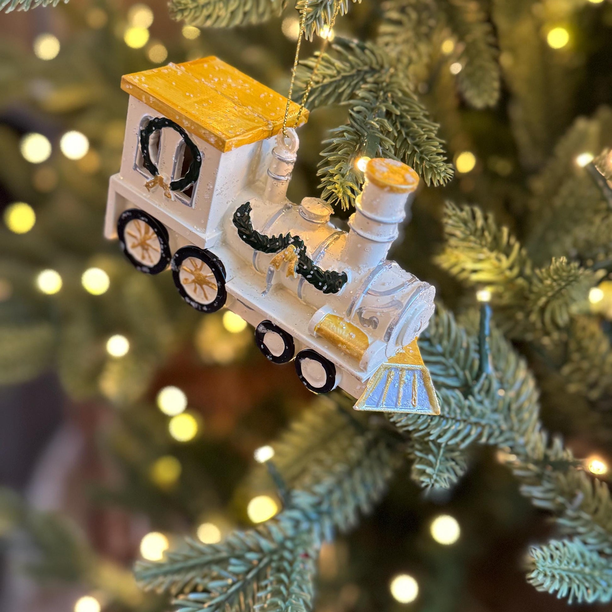 White & Gold Train Bauble – Festive locomotive ornament with green garland detail