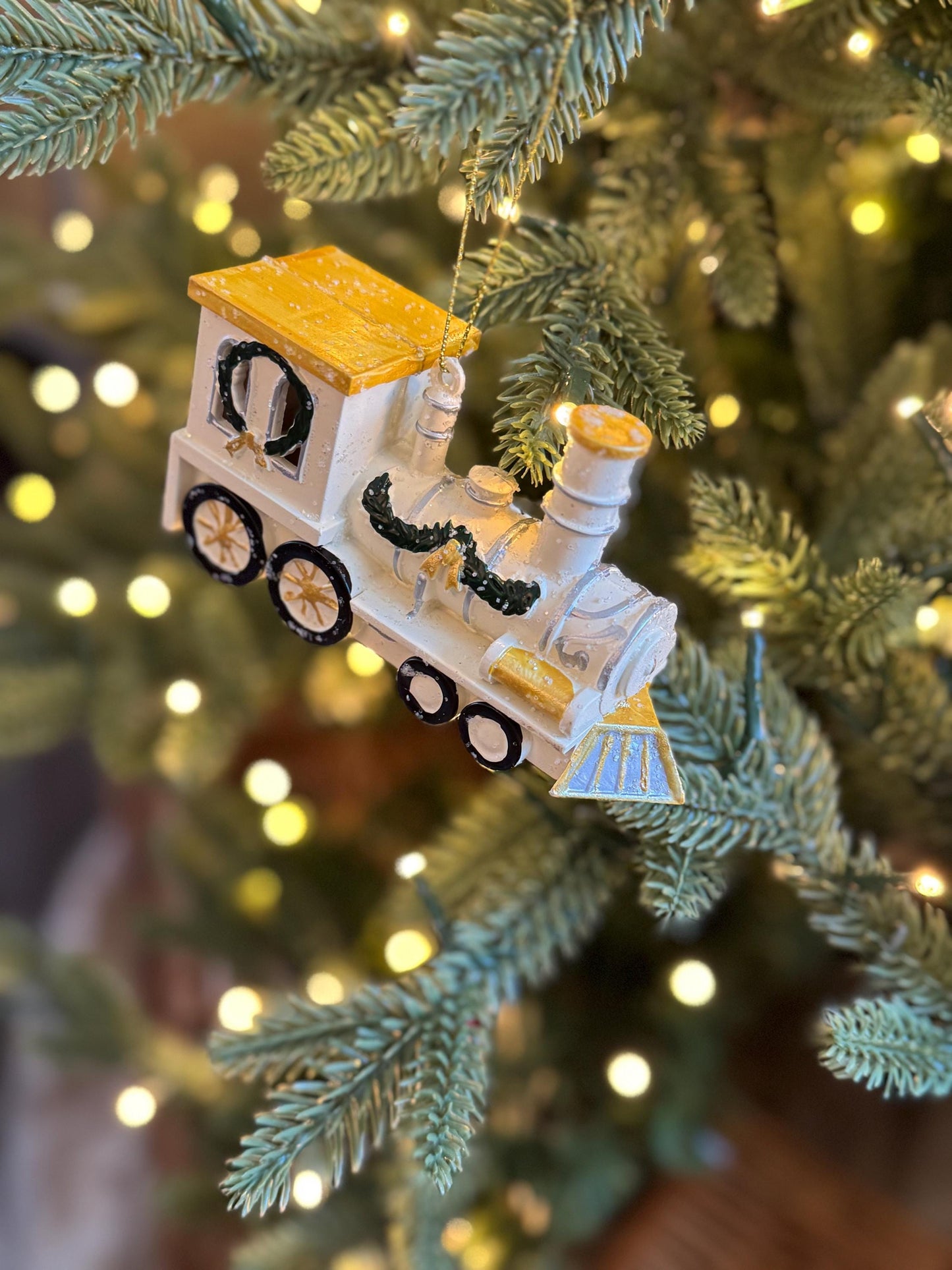 White & Gold Train Bauble - Festive locomotive ornament with green garland detail
