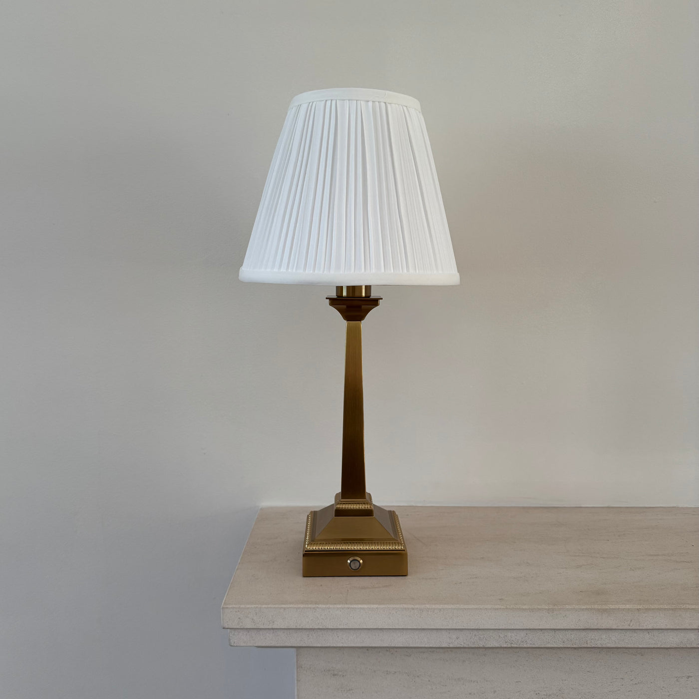 Mayfair rechargeable table lamp in brushed gold with white pleated shade for elegant ambient lighting