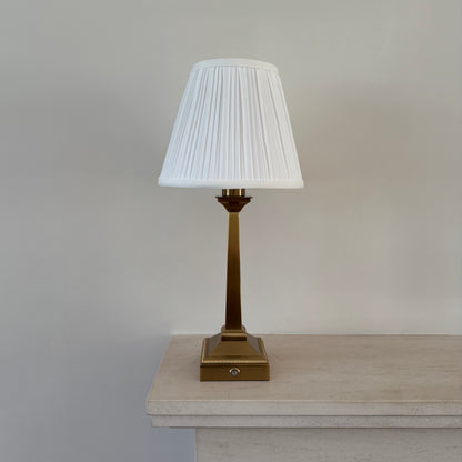Mayfair rechargeable table lamp in brushed gold with white pleated shade for elegant ambient lighting