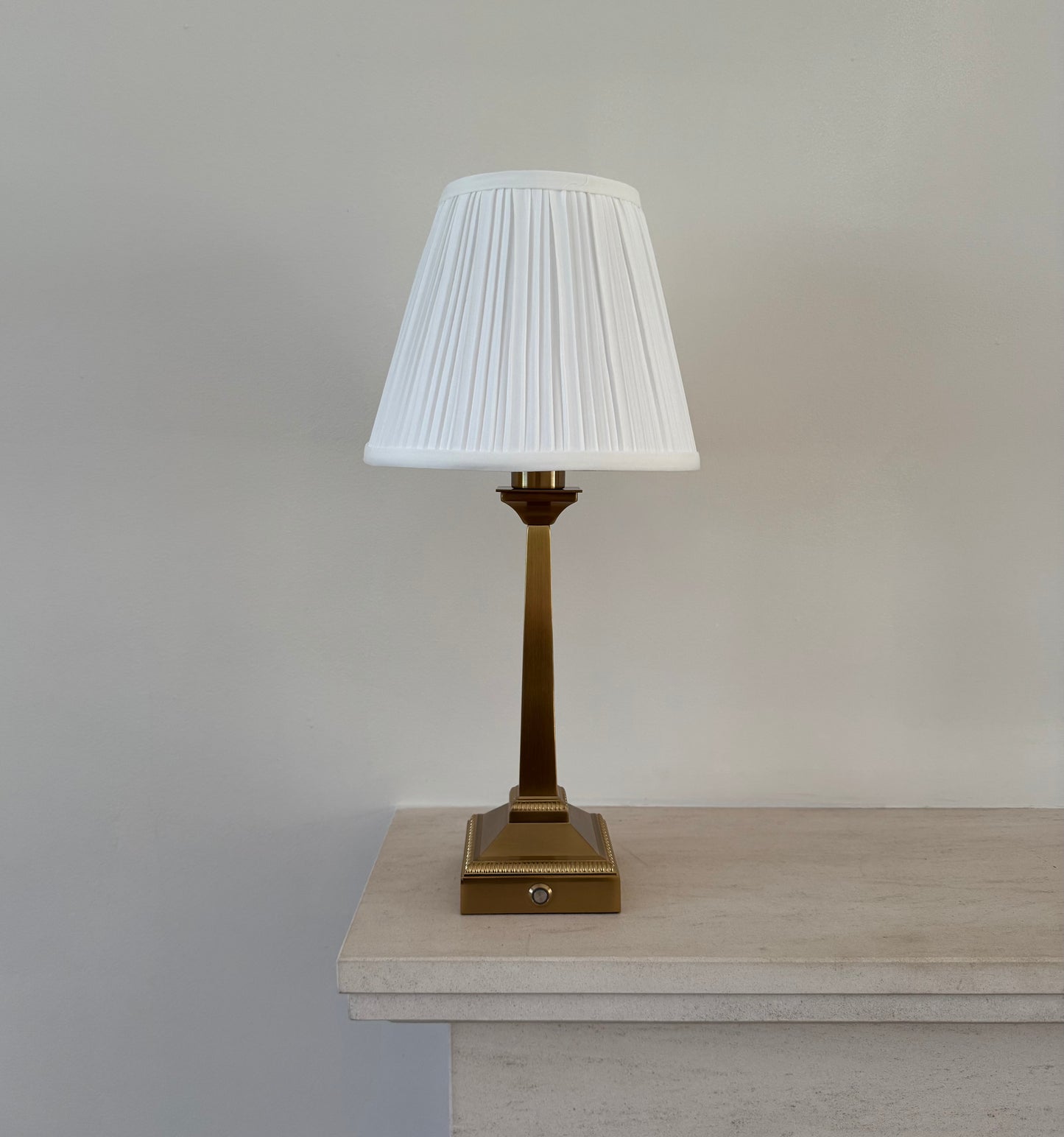 Mayfair rechargeable table lamp in brushed gold with white pleated shade for elegant ambient lighting