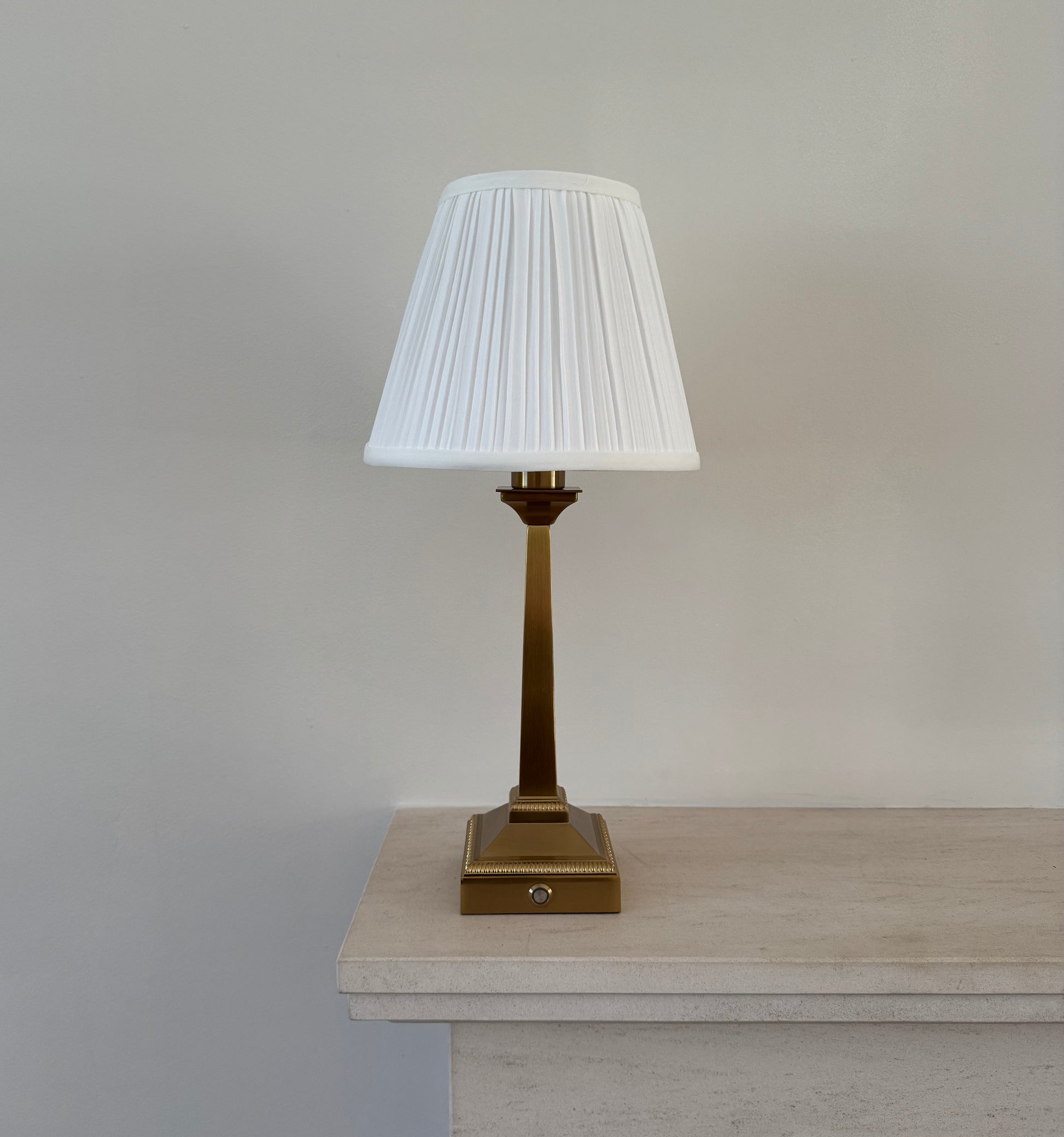 Mayfair rechargeable table lamp in brushed gold with white pleated shade for elegant ambient lighting
